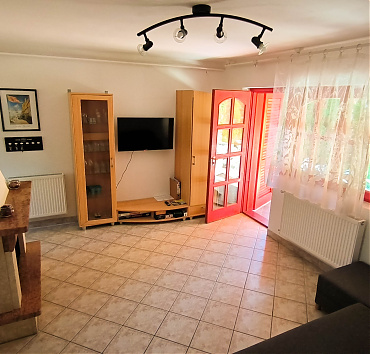 Annex Living Room - We have a normal-sized living room that shares space with a decorative fireplace.